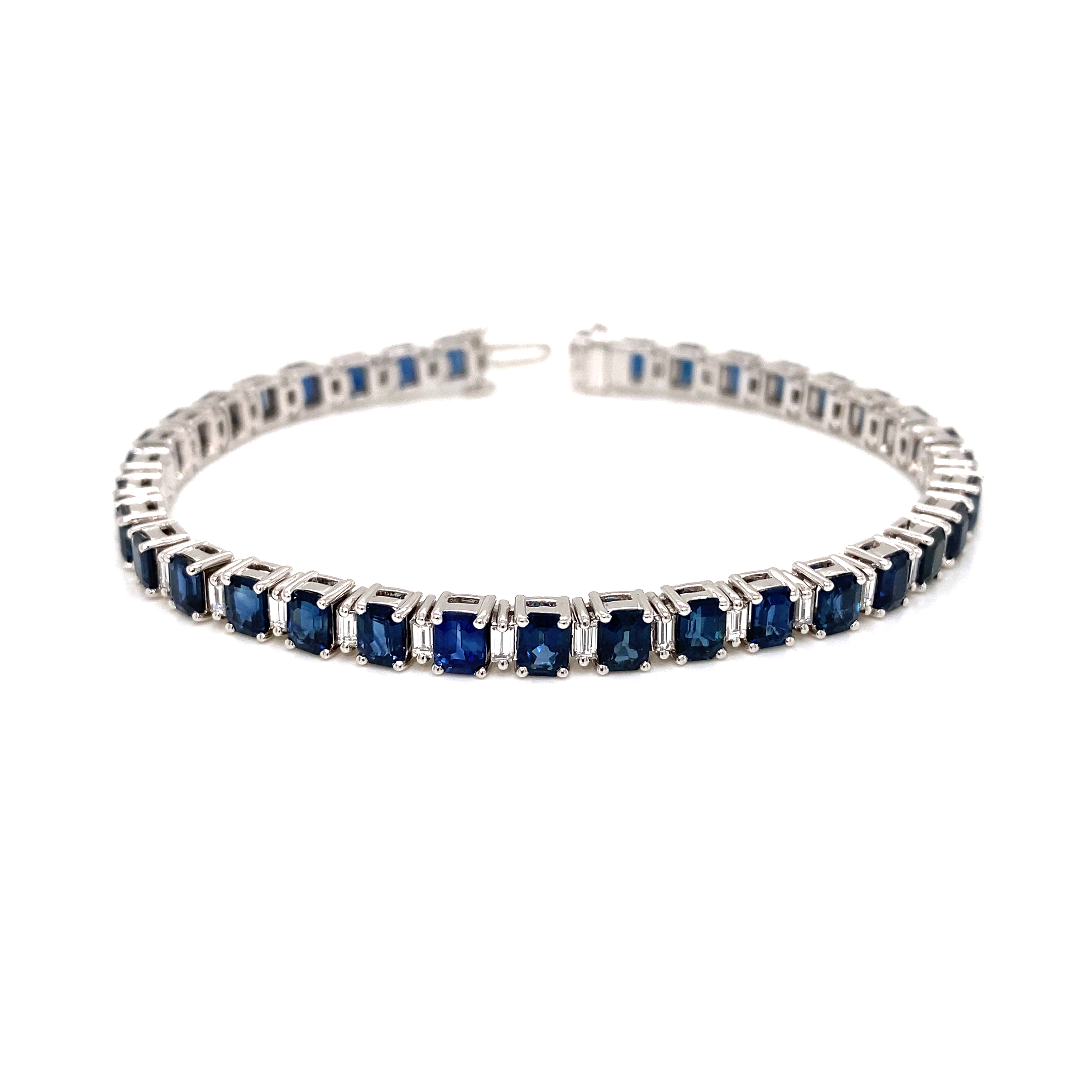 18K hv.gull tennis armbånd - diamanter 1.25ct. & blå safir 11.49ct.