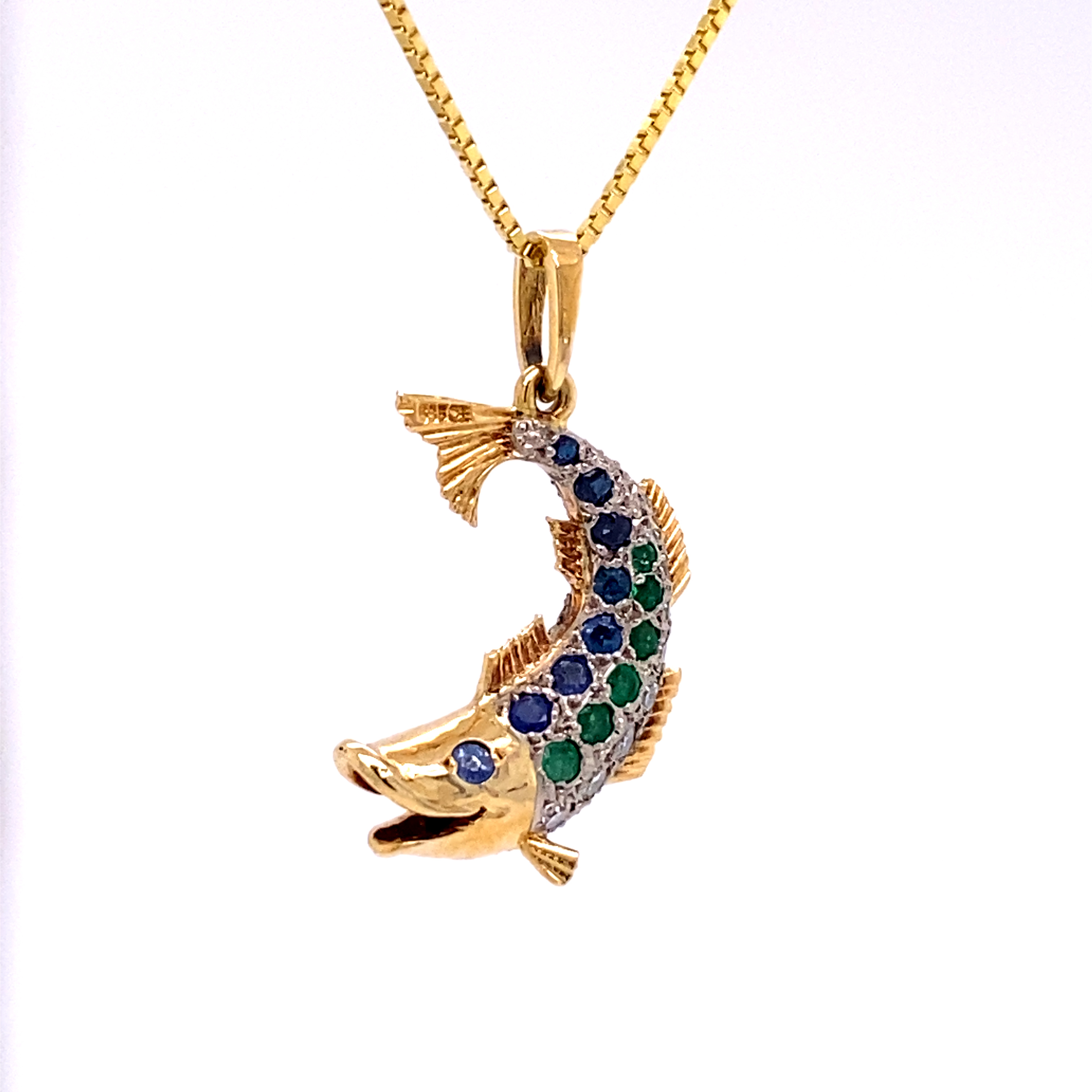 14K Gold Fish - 18 white 8/8 cut Diamonds total 0.50ct - 16 Blue Sapphires total 0.40ct. -12 Emeralds total 0.30ct.